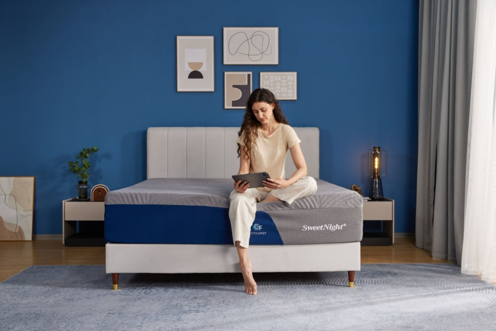 Woman relaxing on edge of medium soft 10 inch memory foam mattress suitable for modern lifestyle.