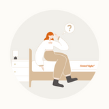 Person contemplating mattress essentials on a SweetNight mattress, considering the need for a mattress protector.