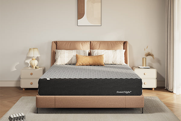 A modern bedroom featuring a SweetNight hybrid mattress with a black and white checkered top on a leather bed frame.