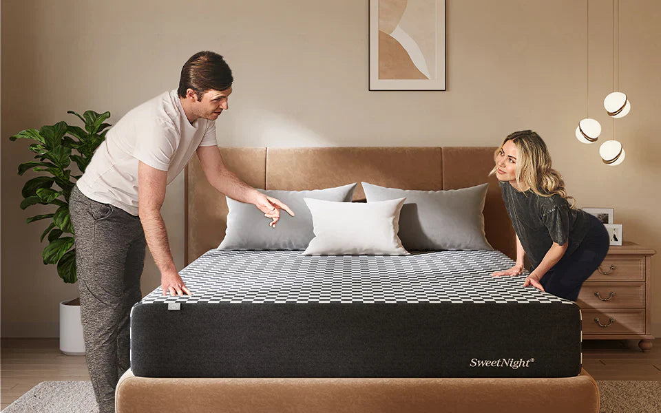 A couple discusses the features of a new SweetNight mattress, choosing the right model for their different sleep temperatures.