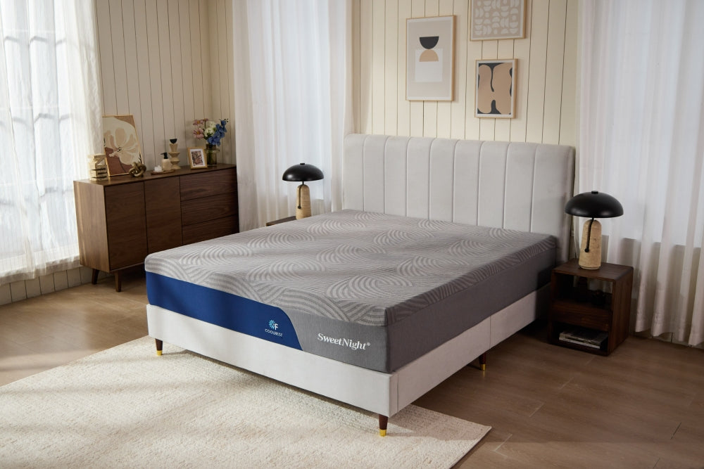 The SweetNight DreamyAlpha hybrid mattress is displayed on a modern bed frame within a brightly lit, stylish bedroom.