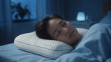 Person resting their head on a cooling pillow in a cool-toned bedroom
