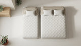 Twin vs full mattress compared side by side, showing the twin at 38 inches wide and the full at 53 to 54 inches wide with identical 75-inch length