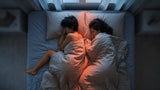 Couple sharing one bed at night with heat building in the space between them