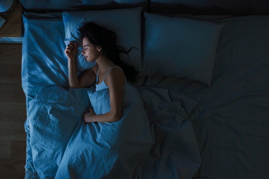 woman sleeping in a dark room
