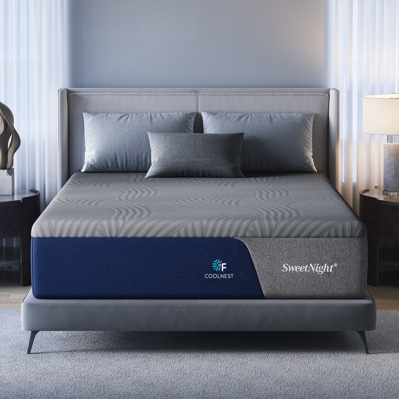 SweetNight CoolNest memory foam mattress on a gray upholstered bed in a light blue bedroom