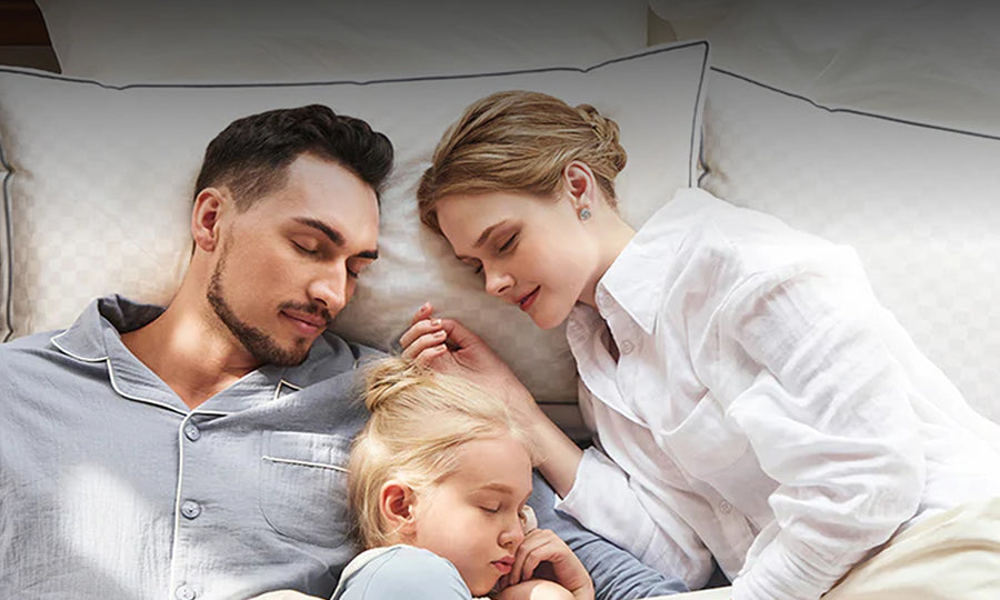 Family resting on SweetNight mattress promoting Black Friday free pillow offer